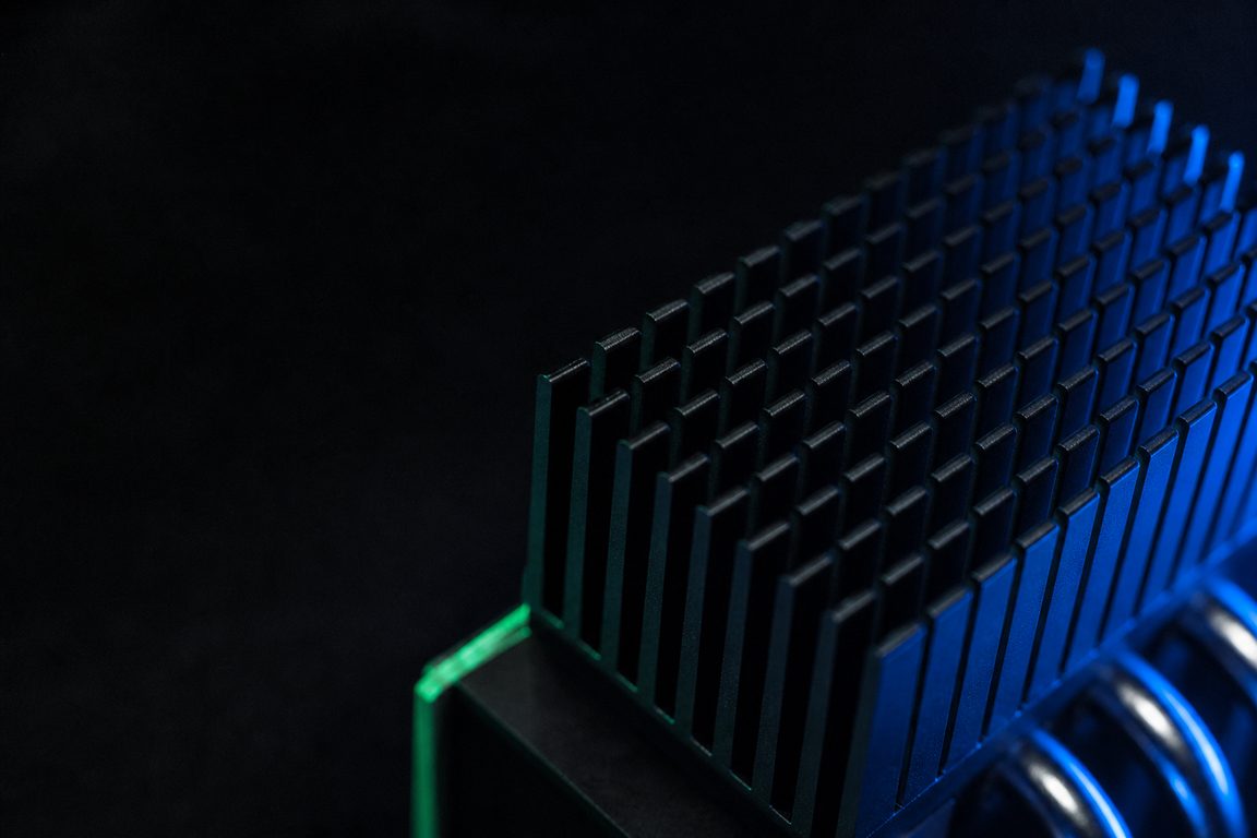 An industrial heat sink with dense fins receding into shadow