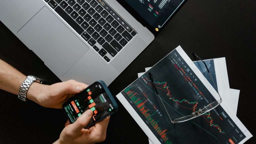 man is checking curve price prediction and its technical analysis using phone